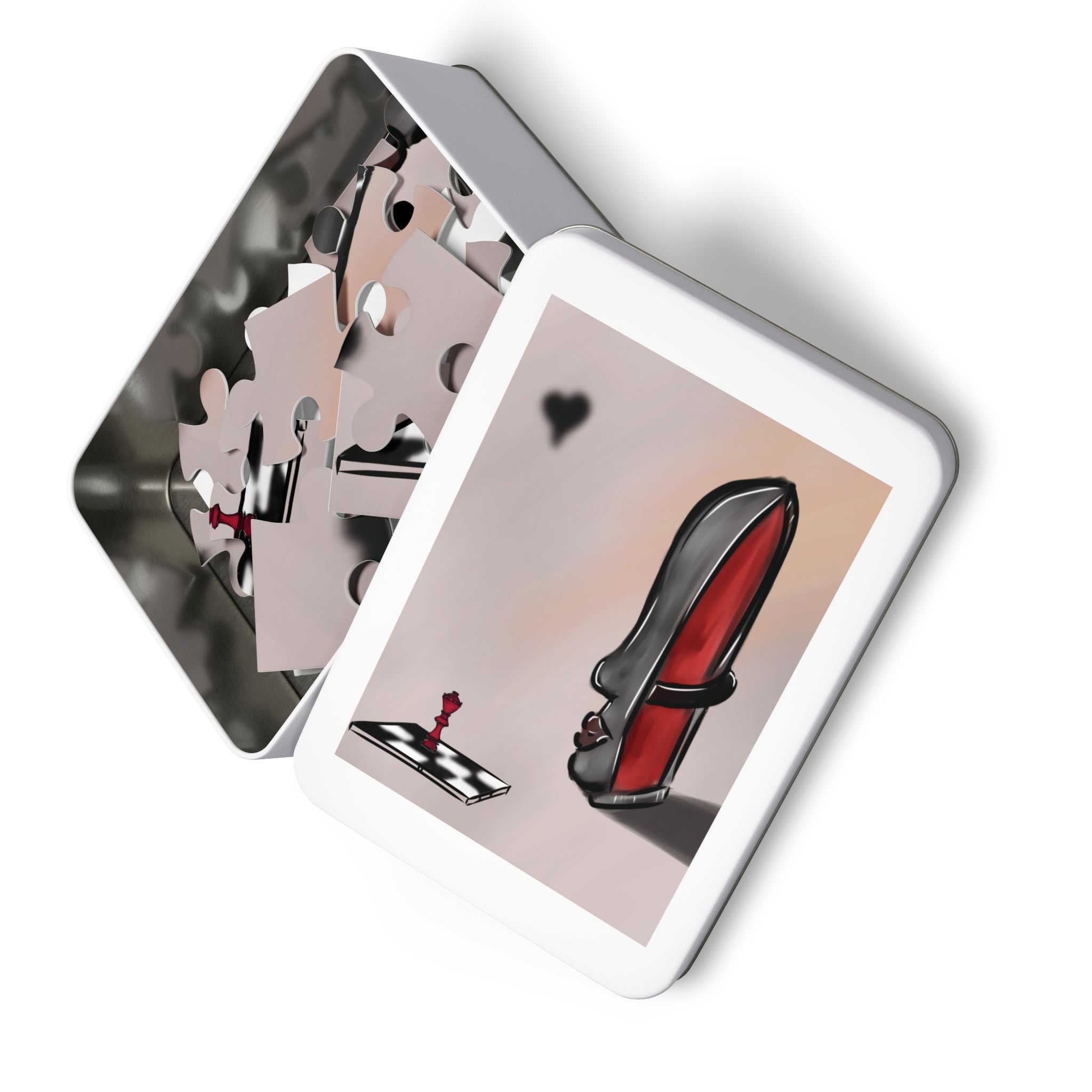 Playing cards with a unique design in a metal tin on a white background